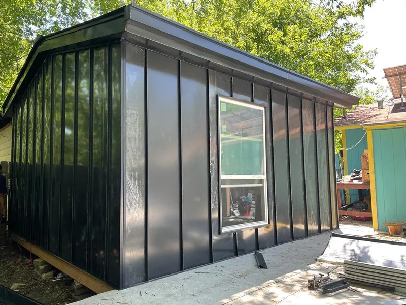 Black standing seam metal wall panels for Roof Inspection in Waveland