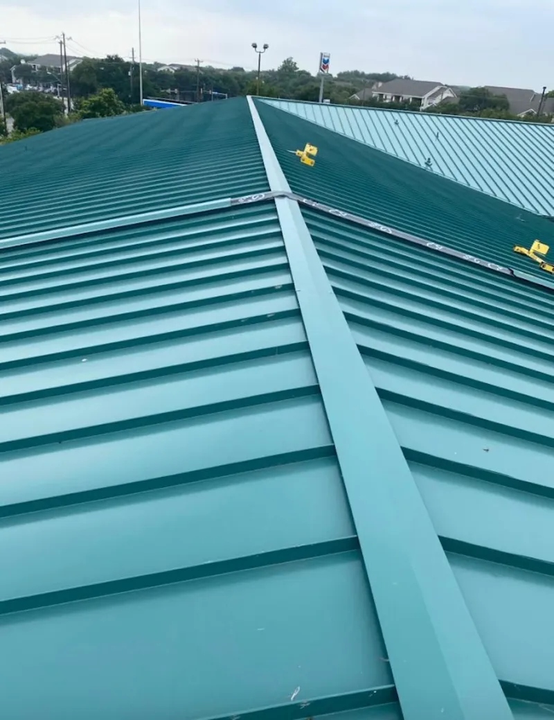 Green commercial metal roof ridge and valley for Metal Roof Repair in Waveland